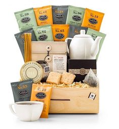 the tea gift box is filled with coffee, cookies and other items that are on display