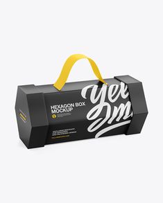 a black and yellow paper bag with the words yee box mockup on it