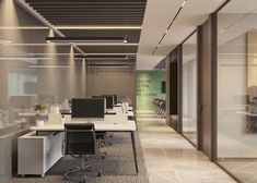 an empty office with two desks and chairs