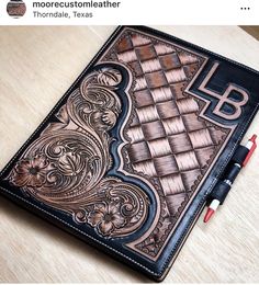 a leather journal with the letter b on it and an image of a chess board