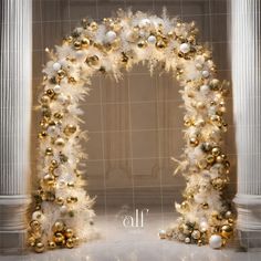 a white and gold decorated arch with ornaments