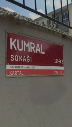 a sign on the side of a building that says kumbal sokag