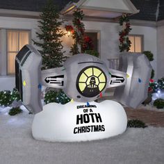 an inflatable star wars christmas decoration with lights and decorations on the front yard