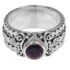 A single stone of amethyst sparkles with purple hues atop this ring from Indonesia featuring designs by Buana who has practiced his craft from a very young age. The ring is handcrafted from sterling silver by local artisans with swirl and dot motifs along the band. Adjustable Purple Amethyst Ring With Stone Setting, Spiritual Amethyst Ring With Gemstone Accents, Purple Crystal Ring With Stone Setting, Spiritual Purple Amethyst Ring, Oval Sterling Silver Filigree Amethyst Ring, Ornate Silver Amethyst Gemstone Ring, Ornate Silver Amethyst Ring For Gifts, Spiritual Sterling Silver Hallmarked Amethyst Ring, Vintage Silver-toned Amethyst Ring Gift