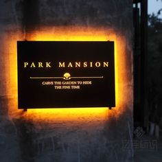 a sign that reads park mansion cave the garden to hide the time lapse up