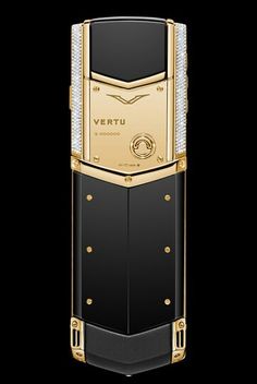 a gold and black cell phone with diamonds on the front, in an angled view