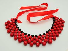 Beautiful wooden necklace. A wonderful accessory for the bride or bridesmaids or girls. Made of high quality materials, The perfect accessory and gift for any woman Handmade Color: red Adjustable Red Necklaces For Wedding, Elegant Party Necklace With Wooden Beads, Adjustable Red Necklace For Wedding, Red Wooden Bead Necklace As Gift, Red Wooden Beaded Necklaces For Gifts, Red Wooden Beaded Necklaces As Gifts, Handmade Red Bib Necklace For Party, Red Bib Necklace As Gift, Red Wooden Beads Jewelry For Gift