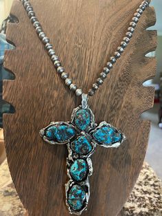 This beautiful sterling silver turquoise cross pendant was completely handmade by myself. It is totally authentic and is absolutely stunning. Each piece of detail work was fire formed and fitted to try to make this one feel right. It is marked sterling and has the maker stamp also. A gorgeous statement necklace I call "the rugged old Cross",,for a great gift.  This is a large size pendant measuring over 4" tall and 3" wide!!  This big piece weighs in at 90 grams including the handmade chain so not for sissies!! Features select and high grade turquoise from old stock Kingman Arizona. This one is priced at well below market and is a lifetime keepsake for the one you love, or heck, just buy it for yourself!! Great Christian gift for your Pastor or yourself. Price includes a fantastic handmade Turquoise Cross Pendant, Rugged Cross, Kingman Arizona, Handmade Chain, Turquoise Cross, Christian Gifts, Silver Turquoise, Turquoise Sterling Silver, Cross Pendant