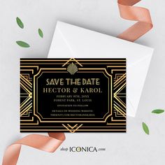 an art deco wedding save the date card with gold foil on it and pink ribbon