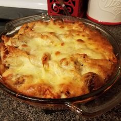 a cheesy dish is sitting on the counter