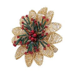 a brooch with red berries and green leaves