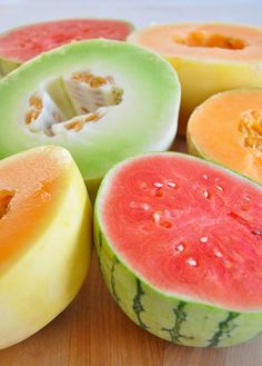 several slices of watermelon on a white plate with red border around the edges