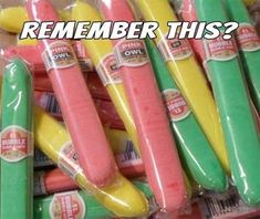 some pink and yellow toothbrushes in plastic wrappers with the words do you remember?