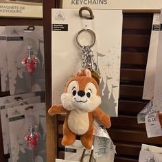 a keychain with a cartoon character on it in front of other key chains