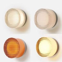 four different types of round lights on a white wall, one orange and one yellow