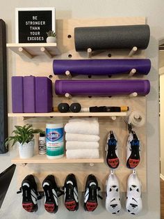 there are many different items on the shelf in this room, including shoes and yoga mats