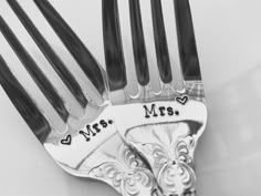 a couple of forks that are sitting next to each other