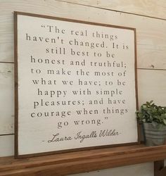 a wooden sign that reads, the real things haven't changed it is still best to be honest and truthful to make the most of what we have to be happy with simple pleasure