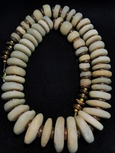 A beautiful 300 years old Agate beads originating from Burma. Cylindrical round shape in great condition with brass counters. Used by rich affluent Burmese royals as a necklace to bring charm and protection Bohemian Rondelle Hand-strung Beads, Bohemian Rondelle Large Beads, Bohemian Necklace With Large Rondelle Beads, Rustic Large Beads Jewelry As Gift, Bohemian Rondelle Necklaces For Jewelry Making, Rustic Beaded Necklaces For Jewelry Making, Bohemian Rondelle Polished Beads Necklace, Bohemian Jewelry With Large Rondelle Beads, Bohemian Rondelle Bead Necklaces