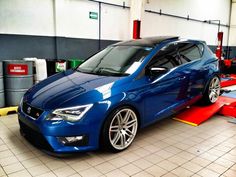 a blue car is parked in a garage