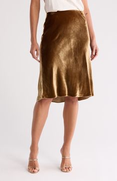 The skirt silhouette of the season is best worn in a silk-kissed satin fabrication. 27" length (size Medium) 82% viscose, 18% silk Dry clean Imported Elegant Gold Silk Bottoms, Silk Midi Skirt Bottoms For Fall, Silk Flowy Skirt For Fall, Flowy Silk Skirt For Fall, Relaxed Silk Skirt For Fall, Elegant Lined Gold Skirt, Silk Lined Skirt For Fall, Silk Skirt For Fall, Formal Silk Skirt For Fall