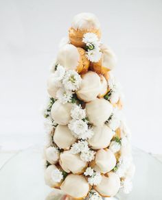 a white christmas tree made out of cookies and flowers