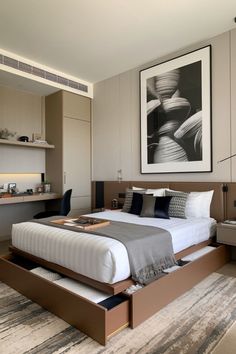 a bedroom with a bed, dressers and pictures on the wall