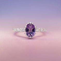 Introducing the exquisite "Juliet" Amethyst and White Topaz Ring – a timeless symbol of love and elegance. Crafted with passion and precision, this enchanting piece will captivate hearts and turn heads wherever it graces your hand. At the center of this ring lies a resplendent amethyst gemstone, deeply alluring with its regal purple hue. The amethyst, known for its association with tranquility and balance, embodies the spirit of royalty, making you feel like a true queen. Its mesmerizing violet Timeless Symbol, Symbol Of Love, Purple Hues, Topaz Gemstone, Moon Child, Topaz Ring, Love Symbols, Amethyst Gemstone, White Topaz