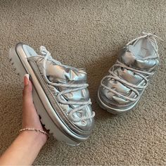 Rp: $130 Sz: 8 Brand New Never Worn With Out-Of-This-World Softness, A Bit Of A Platform, And A Shiny, Maximalist Exterior Crisscrossed With Reflective Laces, The Hi Shine Spaceslider Slide Offers A Unique Look And Indoor/Outdoor Wear. The Outsole Is Crafted From Renewable, Rainwater-Nourished Sugarcane Instead Of Petroleum-Based Eva. Textile Upper Shiny Reflective Laces Faux Fur Lining Textile Sockliner Textile Wrapped Midsole, Foam Midsole Sugarsole Eva Outsole Woven Label With Ugg Logo On Ins Maximalist Exterior, Slides Slippers, Womens Slides, Woven Label, Outdoor Wear, Womens Uggs, Ugg Shoes, Slides, Faux Fur