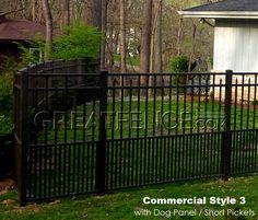 a black metal fence in front of a house