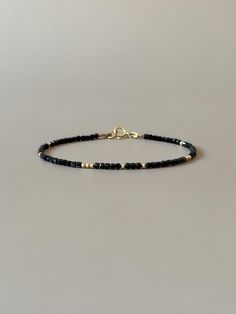 Fall in love with this so dainty black tourmaline bracelet - a perfect piece that features a timeless minimalist design mixed with a boho-chic aesthetic. Made of high-quality genuine  2.2mm black tourmaline cube gemstone beads with randomly scattered 14k gold filled or sterling silver accent beads. It is perfect for stacking or wearing alone and will complement but not overpower any outfit.  Gift-ready in a beautiful branded suede storage bag, perfect birthday, engagement anniversary or wedding