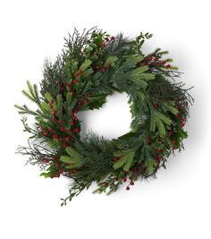 a christmas wreath with red berries and green leaves