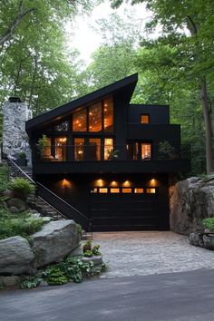 a large black house with lots of windows