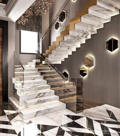 an elegant staircase with marble steps leading up to the second floor