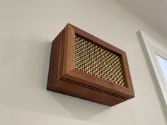 a close up of a wooden object on a wall