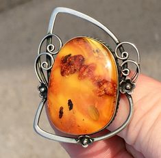 Vintage  Baltic  Amber Brooch from natural  Amber  Weight :  10 gram   Natural amber Brooch are a piece of jewelry that is becoming more and more popular.            Its not only look great , but also have all the healing properties of the sun stone. PLEASE! Before ordering, be sure to look carefully Photo. decide on the size to avoid any misunderstandings. If you need additional photos or have questions about this ring, I am at your service. Colors in photos may differ depending on your monitor settings.     Customer satisfaction and 5 star rating are very important to us. We accept returns within 30 days, however, we guarantee the highest quality, So please send us an email with your question and feedback! If you want to buy an expected item, please ask me a question before buying.  You Amber Brooch Jewelry Gift, Amber Brooch, Sun Stone, Natural Amber, Vintage Fall, Baltic Amber, Healing Properties, Favorite Jewelry, Brooch Pin