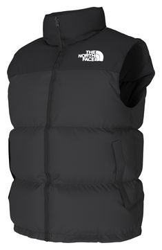 A retro North Face vest based on a baffle-quilted, down-insulated design from 1996 offers unmatched warmth right at the core. The durable ripstop shell with double-layer taffeta at the shoulders is perfect for backpacking, thanks to its packable design that can be stowed in its own pocket. 26 1/2" length (size Medium) Front two-way zip closure Stowaway hood Sleeveless Front zip pockets; interior zip pocket Lined with 700-fill power goose down 40D 54 g/m² 100% nylon ripstop with durable water-rep Nylon Puffer Jacket With Padded Collar For Outdoor, Black Puffer Vest For Outdoor, Functional Nylon Puffer Jacket By The North Face, Functional Nylon Vest With Padded Collar, Black Nylon Puffer Jacket By The North Face, Functional Windproof Hiking Vest, Outdoor Nylon Vest With Padded Collar, Nylon Vest With Padded Collar For Streetwear, Nylon Vest With Padded Collar For Outdoor