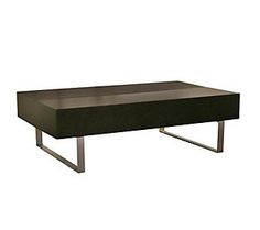 a black coffee table sitting on top of a metal frame