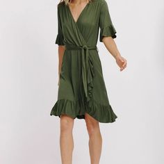 Nwt La Made Aileen Ruffle Wrap Dress In Dark Grey. Model Is Shown Wearing In Green. Photo To Show Fit Of Dress. Dress Is Knee Length, Ruffles Along Hemline And Sleeves, Wrap Style Top With Elastic Waist And Cloth Belt With Loops On Dress. Made Of 95% Micromodal And 5% Spandex. Measures 18” Along Bust And 38” Long. Dress Is Super Soft And Flowing! So Pretty! Belted V-neck Dress For Brunch, Green V-neck Dress With Ruffle Hem, Belted Dress With Surplice Neckline For Brunch, Green Midi Dress With Tie Waist And Surplice Neckline, Green Flowy Dress With Surplice Neckline, Green Surplice Neckline Dress With Tie Waist, Brunch Dress With Ruffle Hem And Surplice Neckline, Mid-length Ruffle Hem Dress For Brunch, Green Dress With Tie Waist And Surplice Neckline