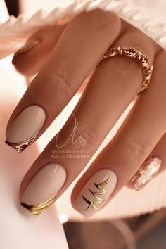 Beige Classy Christmas nails with gold diagonal French tips, a gold Christmas tree nail art on an accent nail, and two rose gold glitter accent nails! Nails With Gold, Tree Nails, Christmas Gel Nails, Christmas Nails Acrylic, Festival Nails, New Year's Nails, Xmas Nails, Chic Nails, Gorgeous Nails