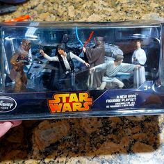 star wars action figures are displayed in a plastic case