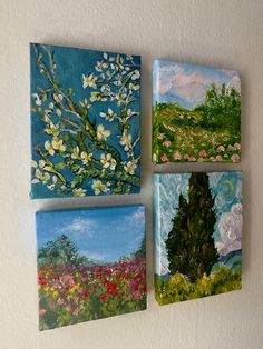 four paintings are hanging on the wall next to each other, one has a tree