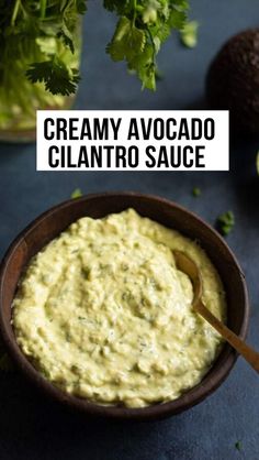 creamy avocado cilantro sauce in a wooden bowl