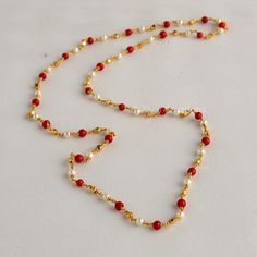 Embrace the allure of tradition with our Coral Pearl Necklace--a fusion of antique charm and Jaipuri elegance. This Mala set, a blend of traditional and fancy elements, features vibrant coral color beads and lustrous pearls. The necklace exudes sophistication, complementing any outfit effortlessly.  This personalized jewelry piece is my own design, and I welcome any customization requests. Elevate your style with this exquisite Indian jewelry. Length - 30 inch Pearl Coral Necklace Indian, Coral And Pearl Jewellery, Traditional Festive Necklace With Delicate Chain, Elegant Festive Necklace With Delicate Chain, Festive Elegant Necklace With Delicate Chain, Bridal Beaded Chain Necklace For Festivals, Traditional Wedding Necklace With Delicate Chain, Traditional Wedding Jewelry With Delicate Chain, Elegant Gold Kundan Necklace With Beaded Chain