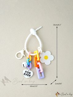 the key chain is made out of plastic beads and has flowers on it, which says for ever