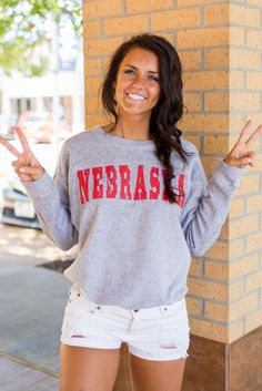 Nebraska Huskers Sweatshirt Varsity Tops For Game Day, Collegiate Tops With University Logo For Game Day, Sporty University Logo Tops For Game Day, Collegiate Tops With University Logo, University Logo Crew Neck Top For Fan Gear, University Logo Sports Fan Tops, University Logo Tops For Fan Gear, Sporty College Tops With University Logo, Sporty Tops For Campus During Sports Season