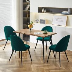 a dining room table with four chairs around it