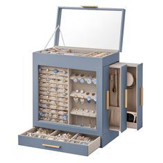 an open jewelry box filled with lots of earrings