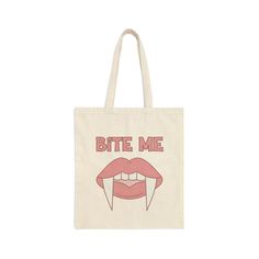 Bite Me Tote | Pink Vampire Tote | Vampire Tote | Vampire Candy Bag | Vampire Halloween Bag | Vampire Trick of Treat Bag | Vampire Tote Bag This 100% cotton bag measures 15" x 16" with 20" handles - perfect for everyday wear. Print appears on one side. Designed by Win's Market and shipped from the U.S. Thank you for visiting the shop and supporting our small business. Please feel free to contact us with any questions. Returns or exchanges are not accepted, but please contact us with any product issues so we can resolve them. Order changes can not be made once the item enters production. Custom Order requests need to be communicated prior to placing the order. Please make sure your Etsy profile contains the correct shipping address as we are not responsible for orders shipped to old address Pink Vampire, Vampire Halloween, Bite Me, Orders Shipped, Candy Bags, Cotton Bag, Custom Orders