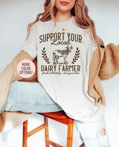 This Support Local Dairy Farmer Shirt is the perfect birthday gift or Christmas gift for all women! All of our shirts are made with the highest quality materials and are super soft and cozy! 💚 HOW TO ORDER 💚 1. Check our photos for sizing and color options. 📏 2. Choose your quantity.  Feel free to add as many shirts as you wish! ✨ 3. Select your size and color from the drop-down menus. ✨ 4. Click "ADD TO CART" to add the shirt to your virtual cart. 🛒 5. Click "PROCEED TO CHECKOUT" to purchase your shirt. 🛒 6. Your shirt is now off to production!  We will process your order and your shirt will be ready for shipment in 1-4 days! 🎁 📏 SHIRT SIZING All of our shirts come in a variety of colors and many different sizes! ✨ SHIRT INFORMATION + MATERIAL Our unisex t shirts fit both men and w Funny Baby Announcement, Baby Announcement Shirt, Breastfeeding Shirt, Baby Announcement Shirts, Farmer Shirt, Mama Shirts, Support Local, Funny Baby, Perfect Birthday